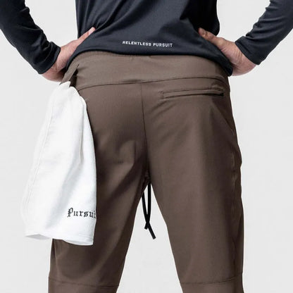 Men's grey fitness trousers with ankle ties, made from 100% polyester for quick-drying during exercise
