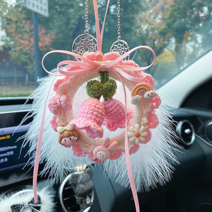 Green woven wool bell orchid car pendant hanging, showing handmade texture and fresh style.