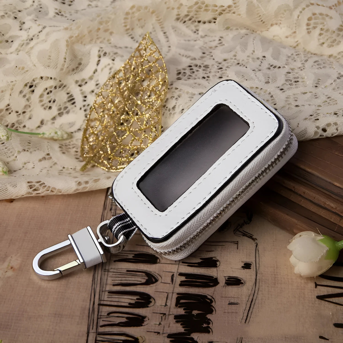 White genuine leather square car key case with plain weave pattern, shown with key bag