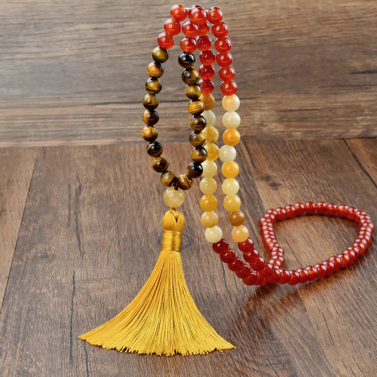 Handmade long necklace with geometric gemstone pendant and tassel on a ball bead chain