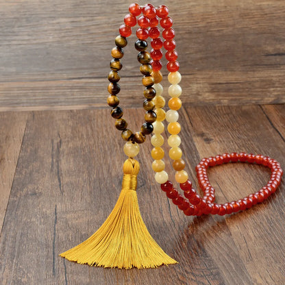 Handmade long necklace with geometric gemstone pendant and tassel on a ball bead chain