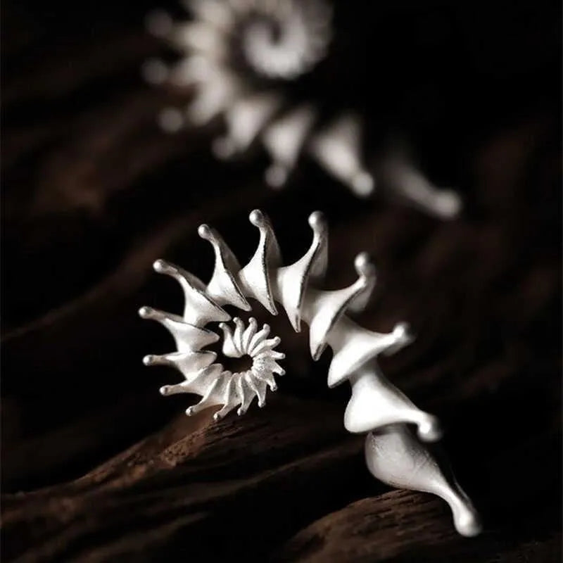 Matte finish conch shell stud earrings with three-dimensional design in alloy metal