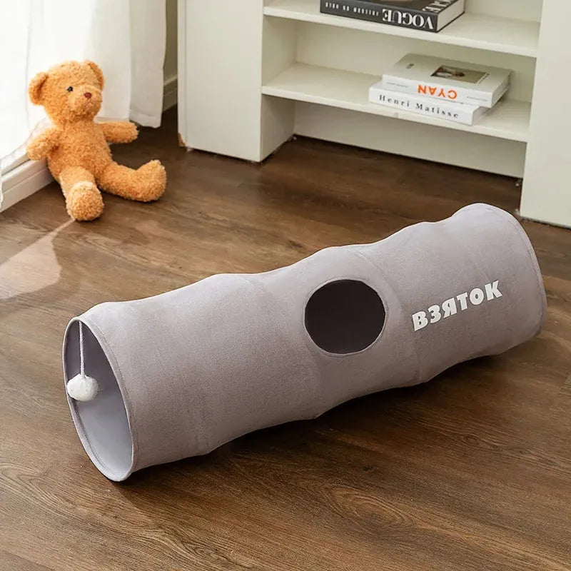 Collapsible cat tunnel in grey with attached plush ball, showing folded and extended positions