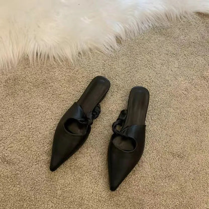 Women's soft leather-lined semi-toe box slippers in neutral colours on a rubber sole.