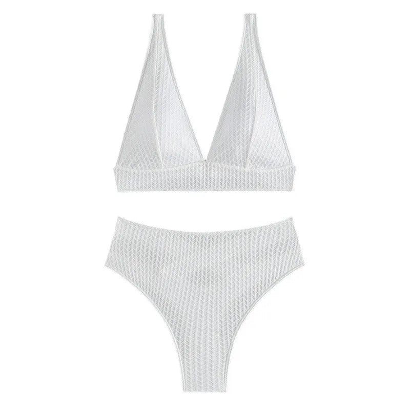 White women's backless bikini swimsuit with brief cut, laid flat showing bra and panties.