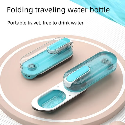 Portable blue dog water bottle with a foldable silicone drinking bowl extended, for outdoor use.