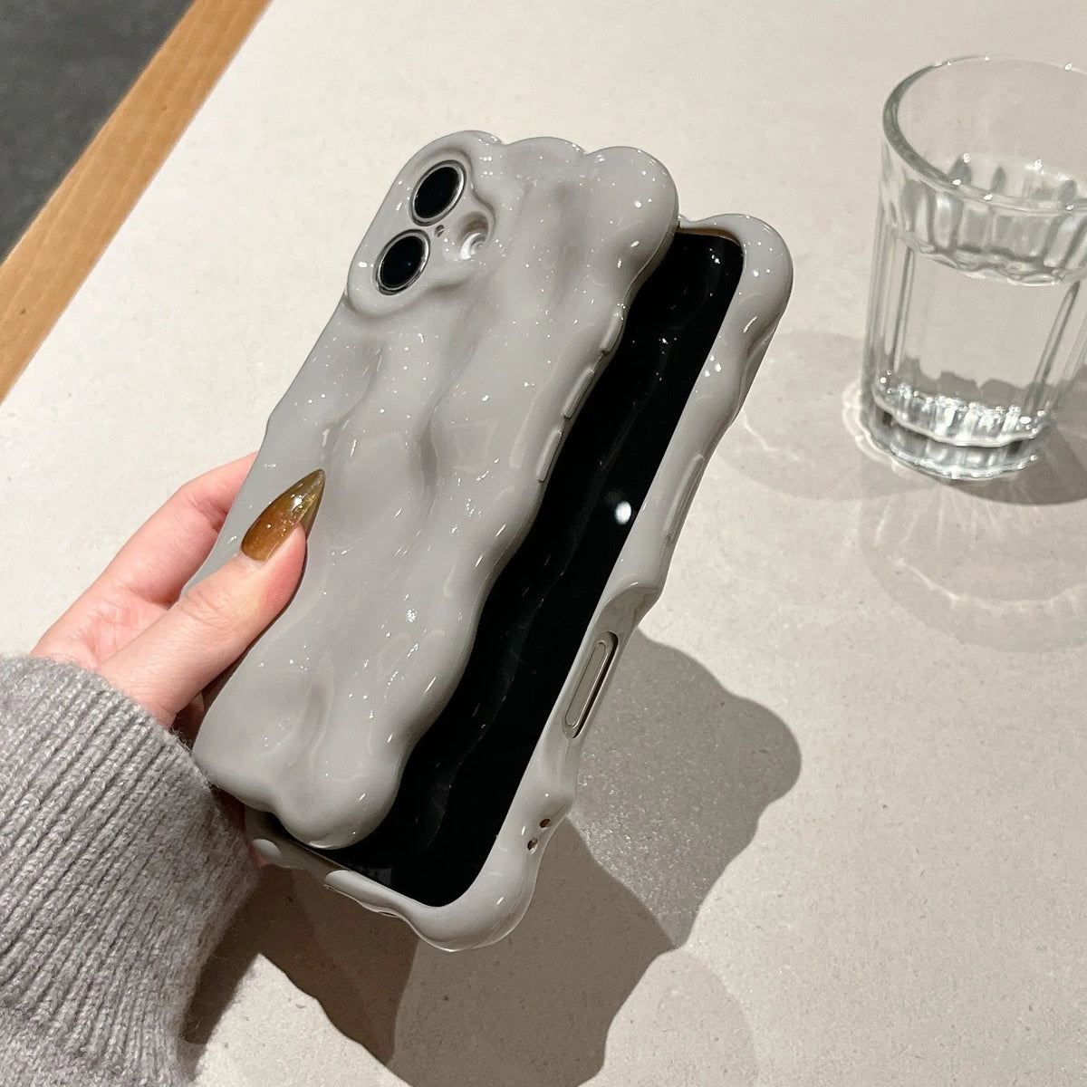 Grey TPU phone case with three-dimensional bubble shell pattern for iPhone 11 to 17 series