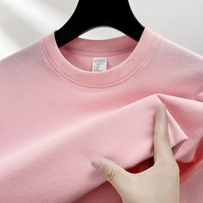 Men's thin cotton drop shoulder t-shirt on a hanger, shown in a light colour.