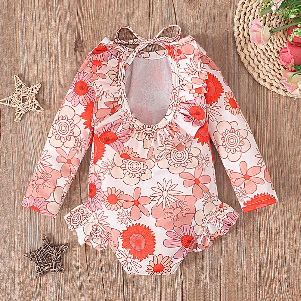 Girl's floral print swimsuit with open back crew neck design in polyester fabric