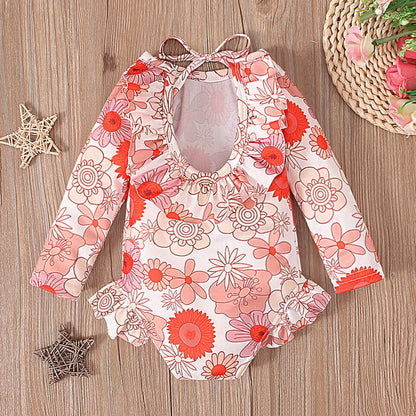 Girl's floral print swimsuit with open back crew neck design in polyester fabric