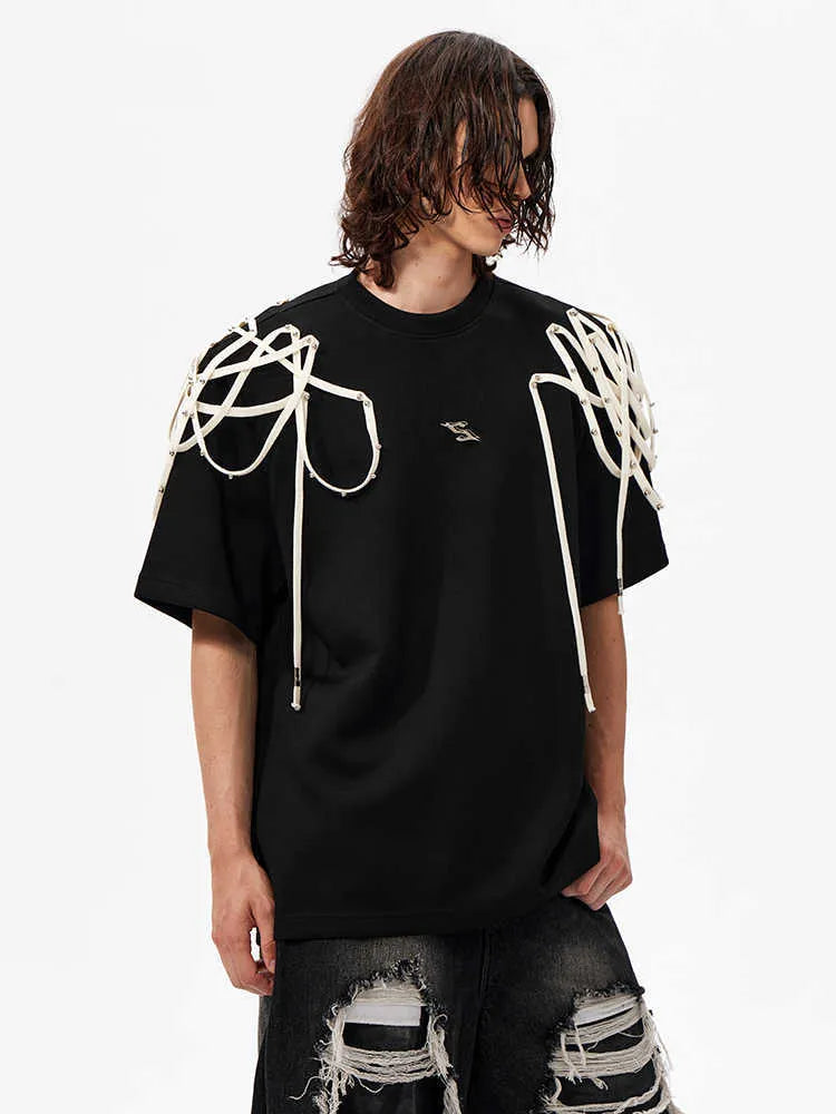 Black loose fit short sleeve T-shirt with rivet ribbon padded shoulder detail and round neck