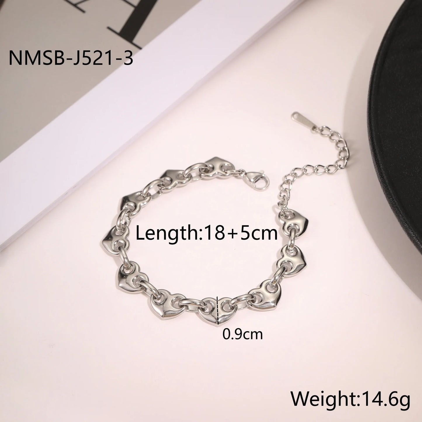 Women's hollow heart bracelet in stainless steel with 18K gold plating showing geometric design