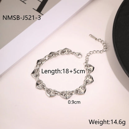 Women's hollow heart bracelet in stainless steel with 18K gold plating showing geometric design