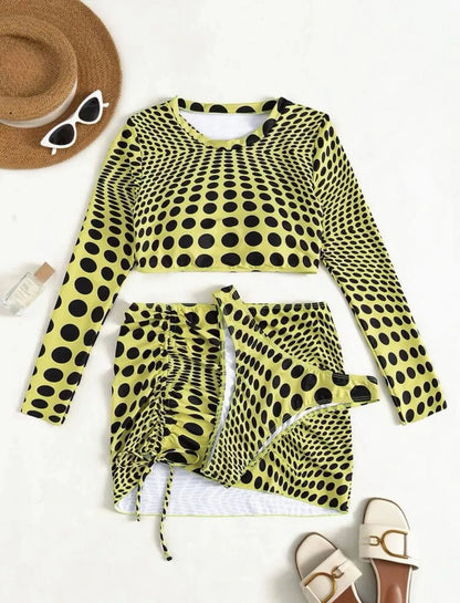 Women's green polka dot three-piece swimsuit set showing top, skirt, and bra