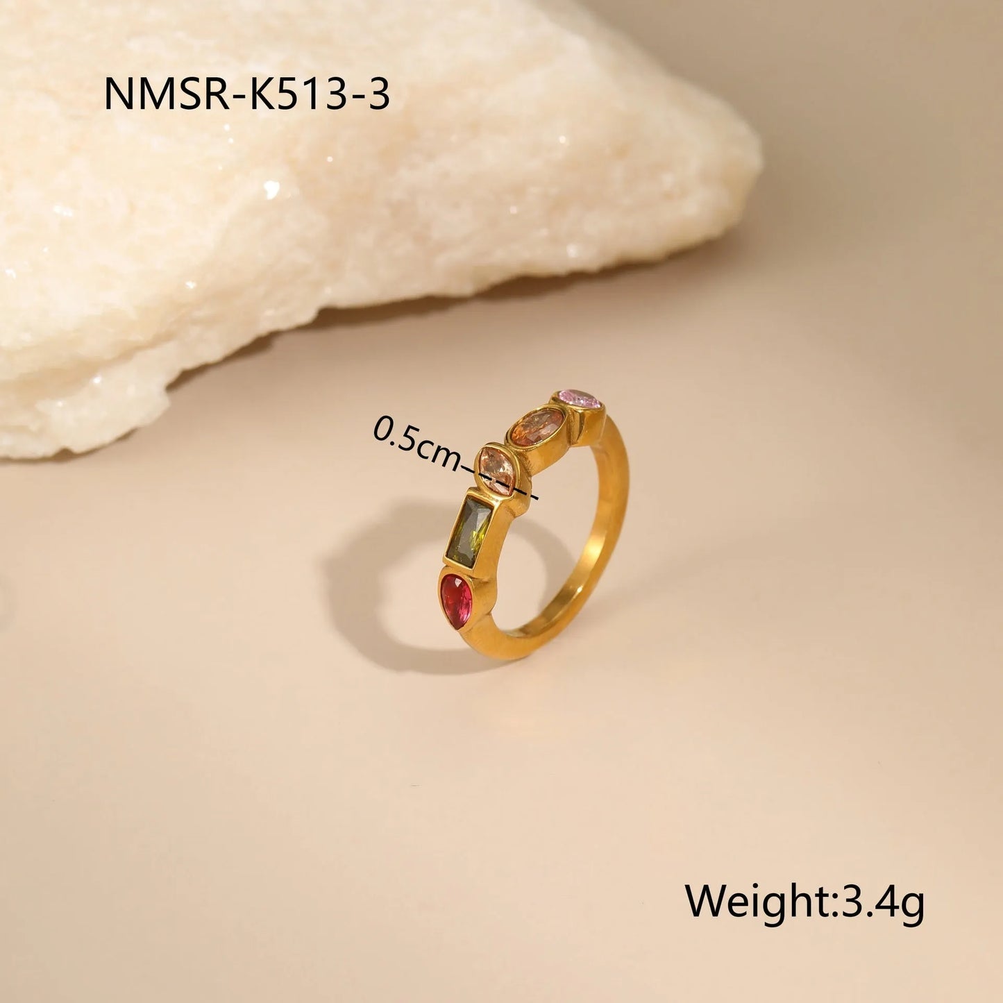 Gold geometric jewellery set with colour zircon accents showing necklace, ring, and earrings