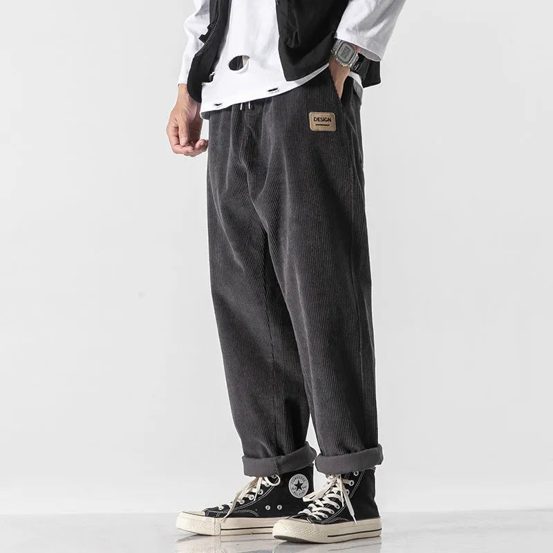 Men's loose fit corduroy sports trousers in Army Green colour with straight leg design and elasticated waist