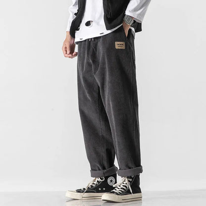 Men's loose fit corduroy sports trousers in Army Green colour with straight leg design and elasticated waist