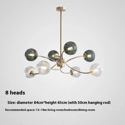 Modern Nordic-style chandelier with multiple green glass shades hanging at different heights.
