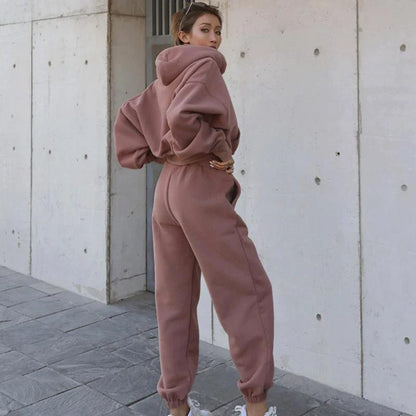 Women's polyester hoodie jacket and sports pants set in various colors for casual and athletic wear