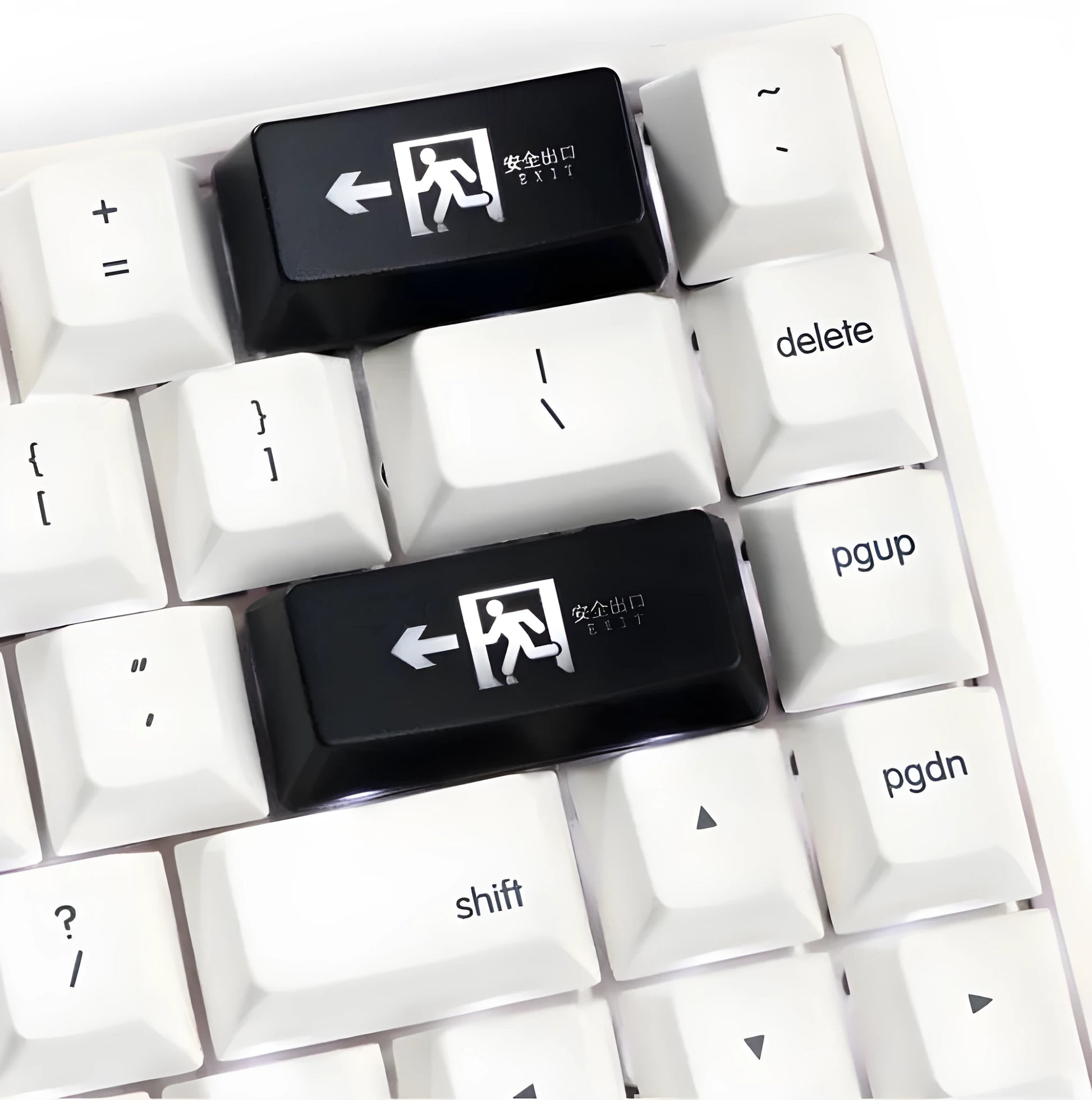 Transparent keyboard key cap with safety evacuation exit symbol design