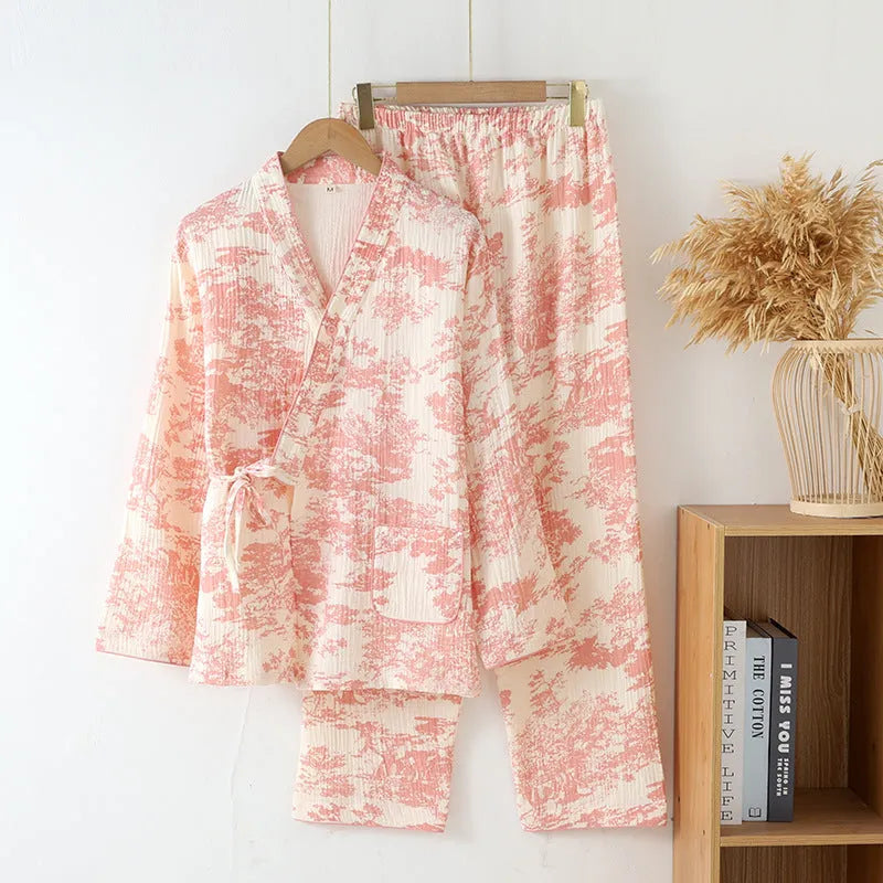 Women's pink pure cotton gauze lace-up top and trousers homewear set laid flat.