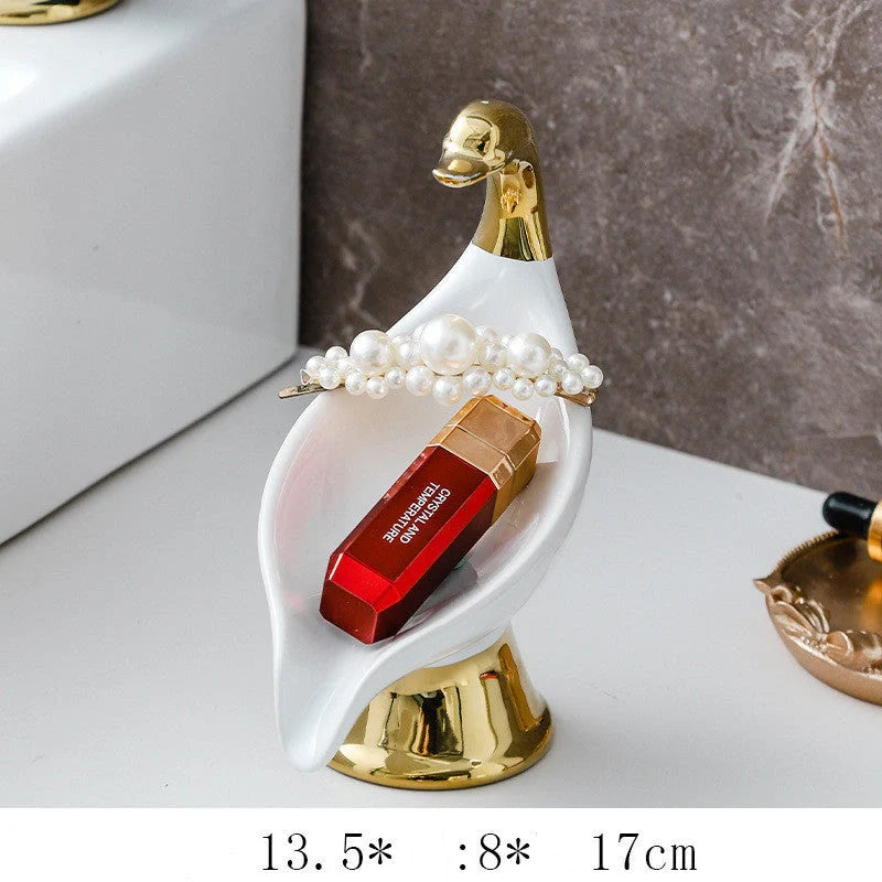 Ceramic swan soap rack in white and green, featuring a drainage cover