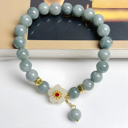 Women's adjustable jade bracelet with rope fastening showing retro styling and optimised jade colour