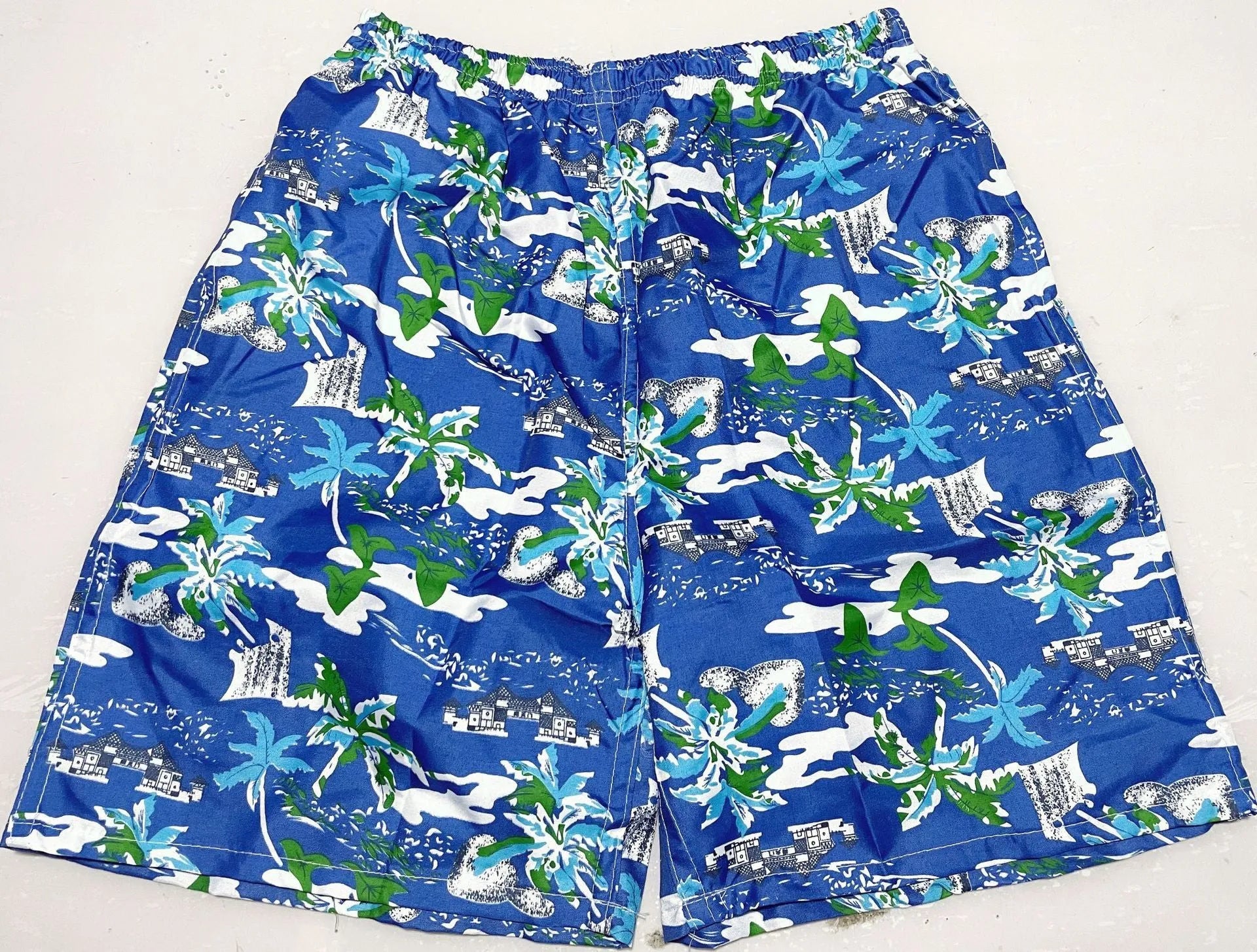 Men's floral patterned swim shorts with five-point cut design