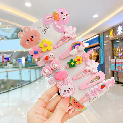 Assortment of colourful toddler hair clips and barrettes with candy, rainbow, fruit, and butterfly designs
