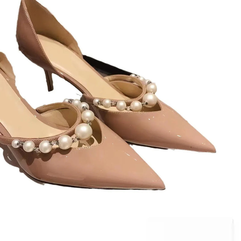 Women's pointed patent leather high heels stiletto heels with pearl decoration in nude, black, or white colours, featuring a rubber sole and sheepskin lining available in UK sizes 34 to 40.