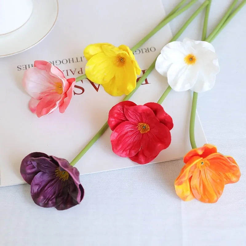 Pack of 15 mini artificial poppy flowers in assorted colours including purple, pink, yellow and red.
