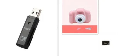X2 HD mini digital camera for kids in silicone case with lanyard, shown capturing photo on 2-inch screen.