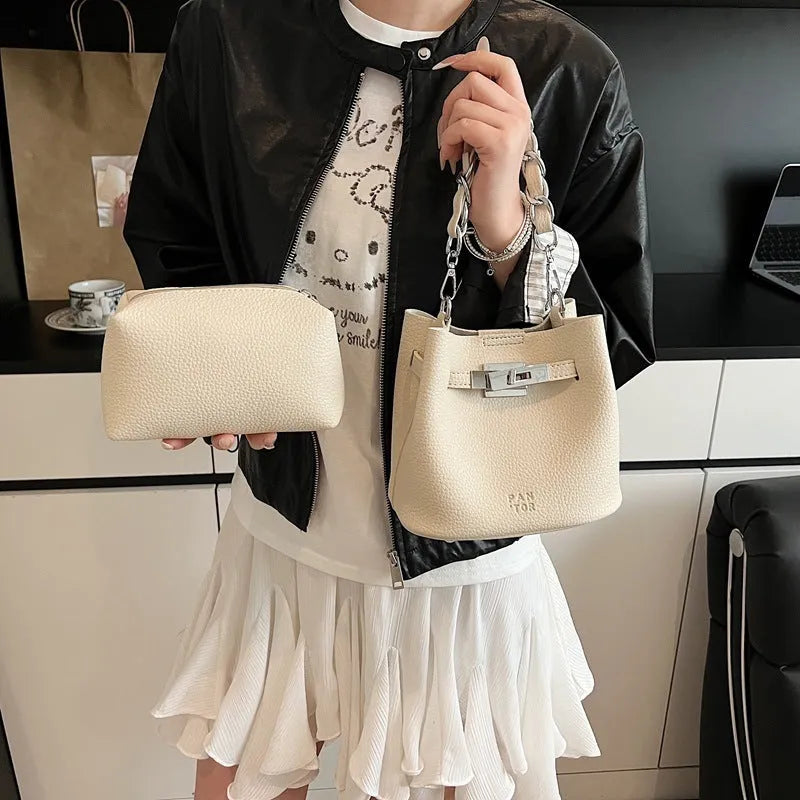 Shoulder bucket bag in soft PU leather with retro styling, featuring crossbody strap and internal organisation pockets including phone bag and zipper compartments, available in black, elephant grey, white and pink, measuring 20x17x13cm.