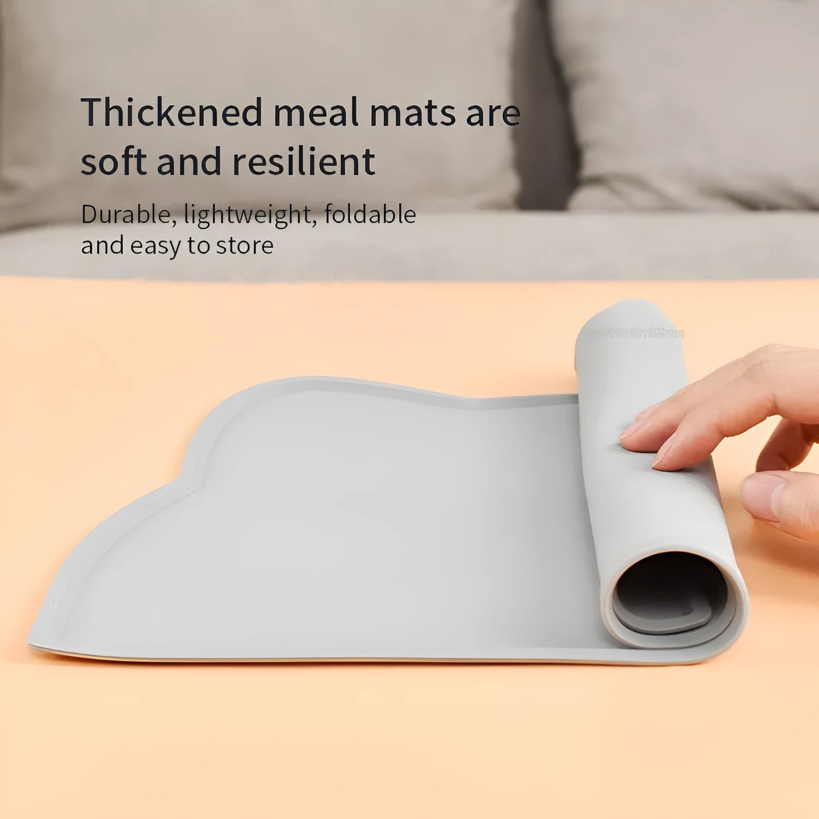 Solid-colour silicone pet feeding mat with cat head design measuring 44 by 24 centimetres