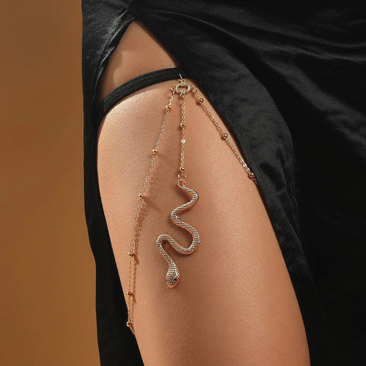 Fashionable gold beaded leg chain with snake pendant for women, featuring a captivating design and adjustable fit for comfortable wear.