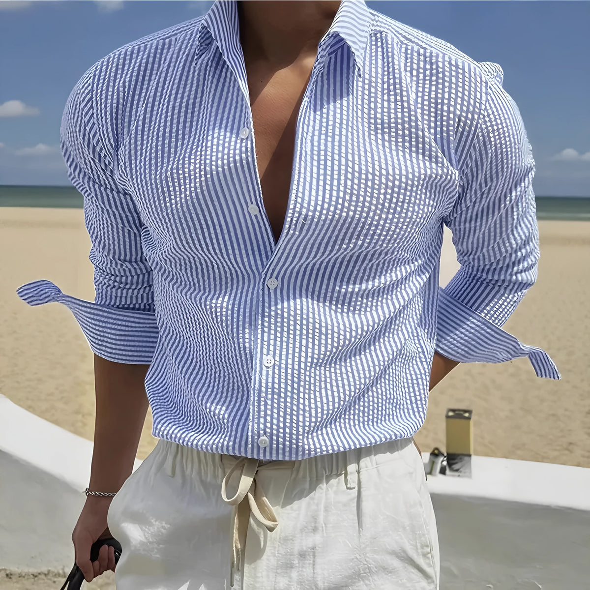 Long sleeve striped shirt with lapel collar on a hanger, shown in a blue colour option.