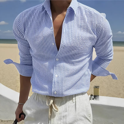 Long sleeve striped shirt with lapel collar on a hanger, shown in a blue colour option.