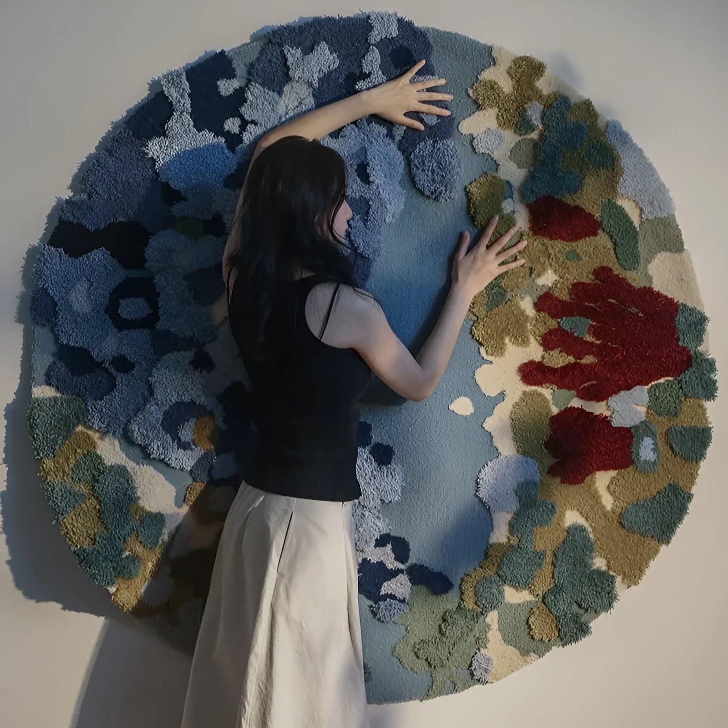 Ocean Secret Realm handmade round acrylic fibre carpet on a wooden floor.