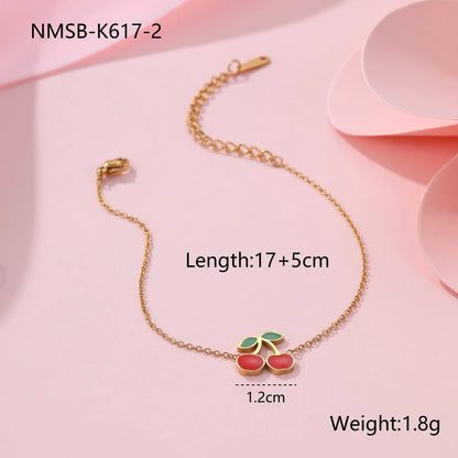 Cherry jewellery set with necklace, bracelet, earrings and ring in gold electroplated stainless steel with geometric fruit design