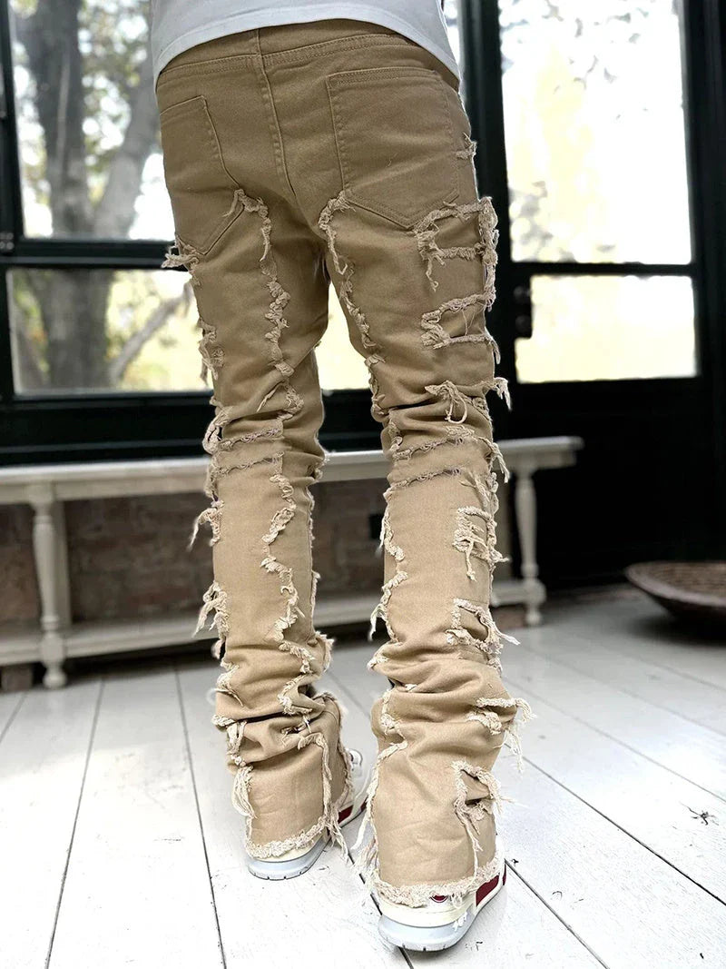 Men's slim-fit cotton jeans with unique patched design in various classic colors