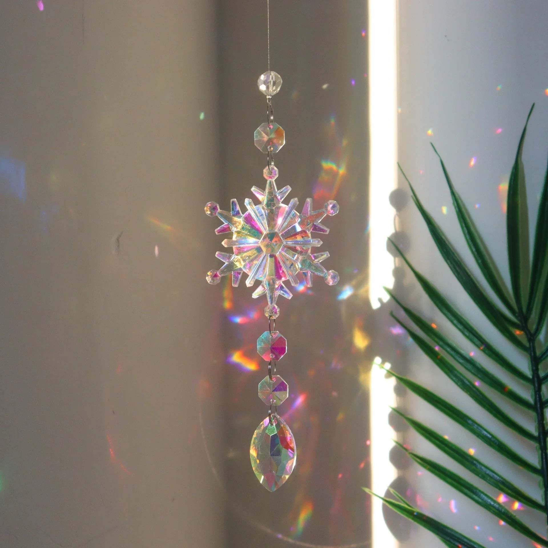 Snowflake Crystal Sun Catcher with intricate design and iridescent AB color finish, creates a mesmerizing kaleidoscope of colors