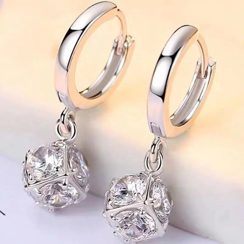 Geometric copper women's earrings with zircon accents and rose design elements in multiple colour variations
