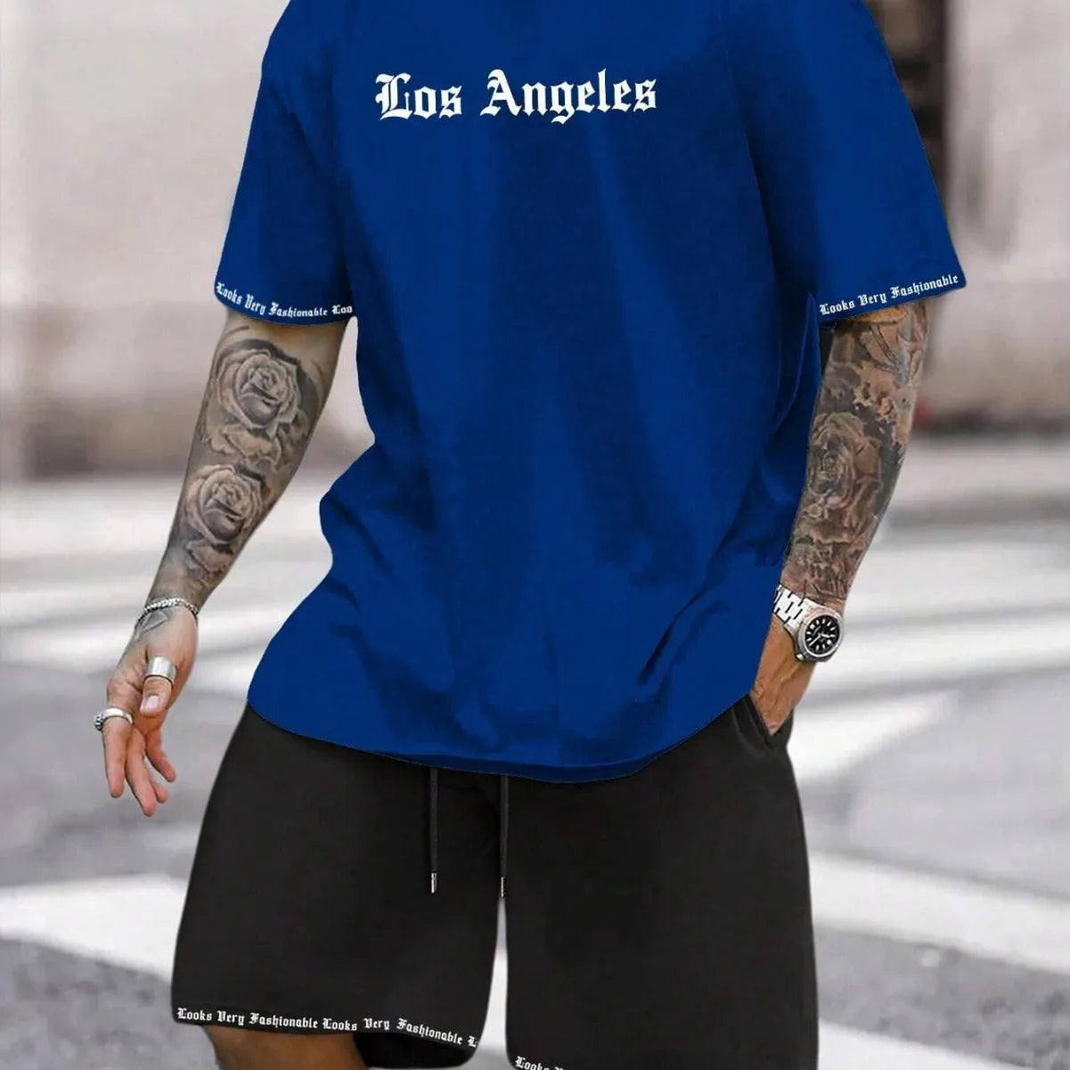 Man wearing a printed short-sleeve sports top and matching shorts in a quick-dry polyester blend.