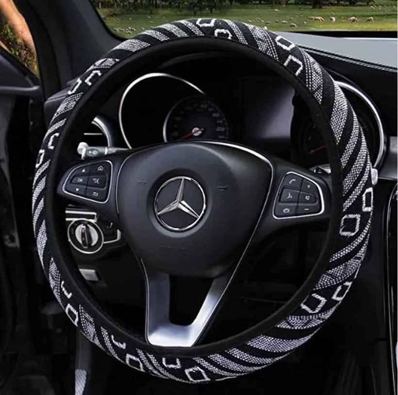 Short plush steering wheel cover in one of seven colours, fitting a 38cm steering wheel with non-slip grip