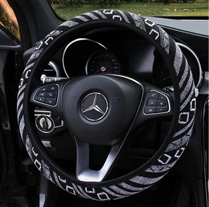 Short plush steering wheel cover in one of seven colours, fitting a 38cm steering wheel with non-slip grip