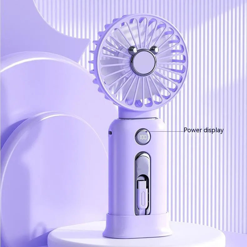 Purple handheld USB fan with power bank ports, shown with a white USB cable.