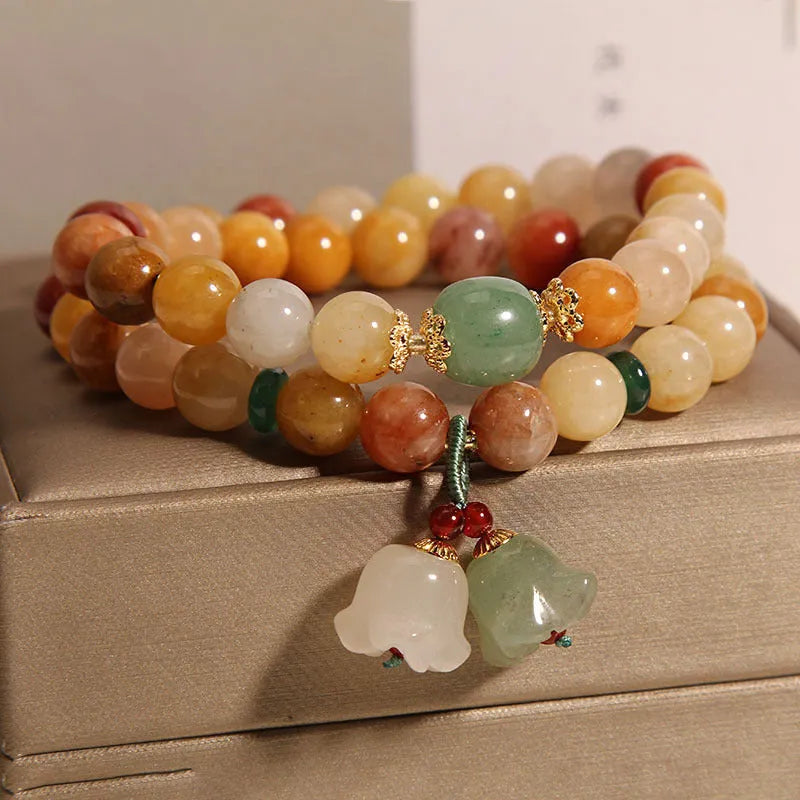 Natural Jinsi Jade Multi-layer Bracelet for Women, featuring an Orchid Pendant charm on a traditional woven silk cord, presenting a classic Chinese-inspired jewellery style for daily wear or special occasions.