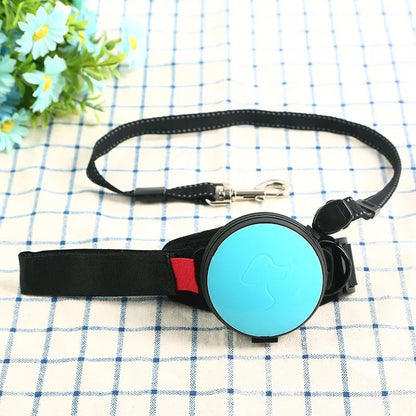 Retractable dog leash with handle and nylon cord in vibrant orange colour, extended to 3 metres.