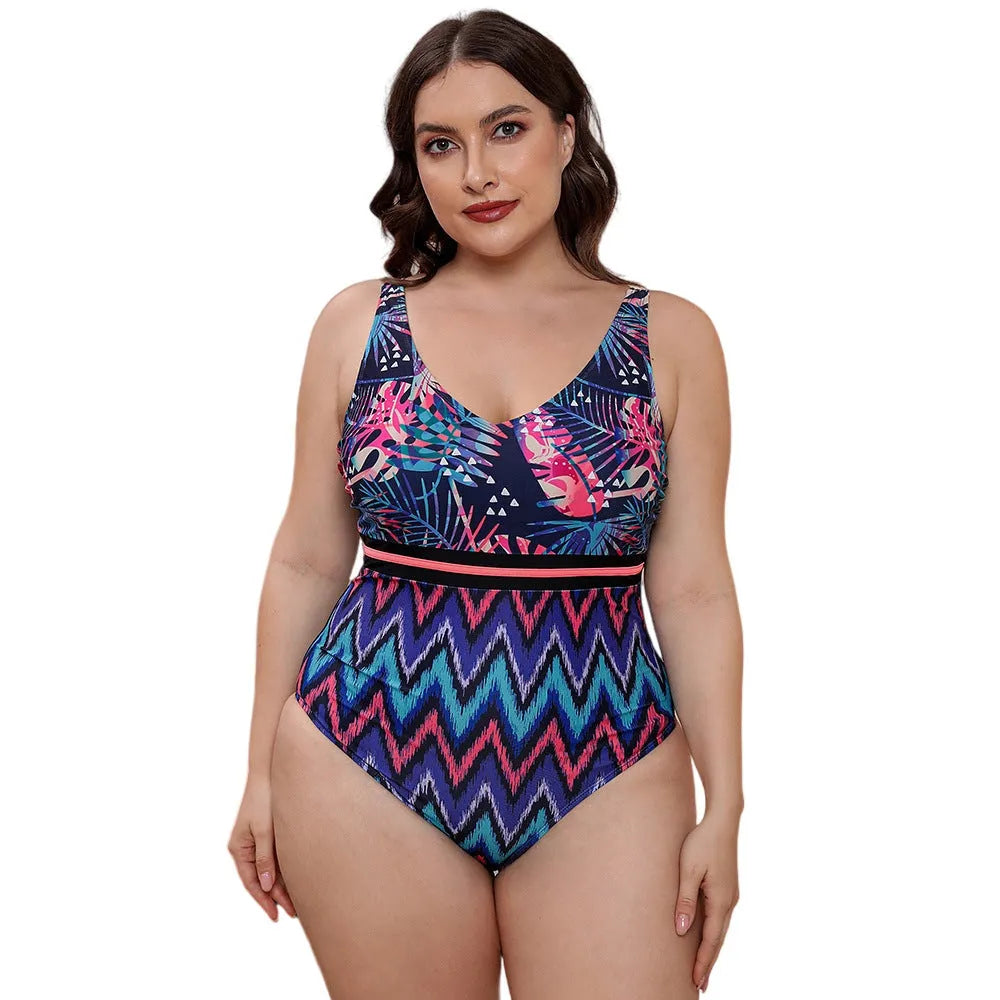 Blue and white printed women's one-piece swimsuit with spaghetti straps and a striped vest design.