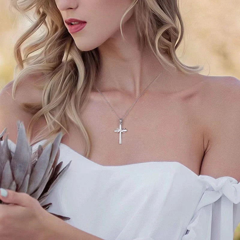 Elegant gold cross and infinity pendant necklace for women, showcasing timeless beauty and spiritual meaning.